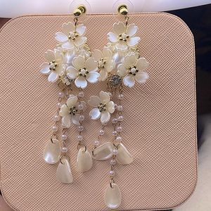 Floral white dangle earrings